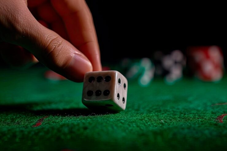 dice on green carpet